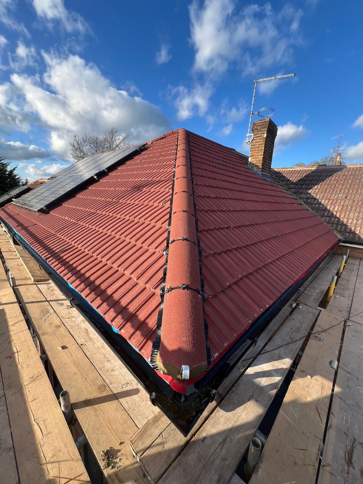 Red Tile Re-roof with Solar — roofing work in Dorset